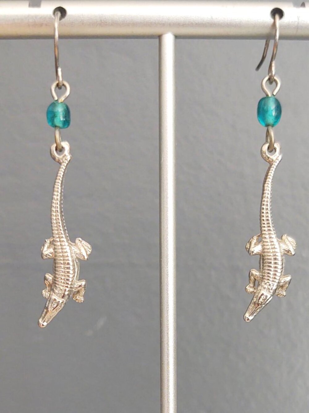 Silver lizard earrings with teal glass beads